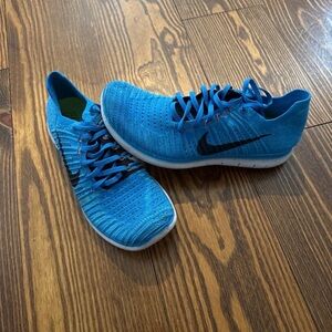 Nike Men’s Bright Blue Flyknit Sneakers with Black Swoosh